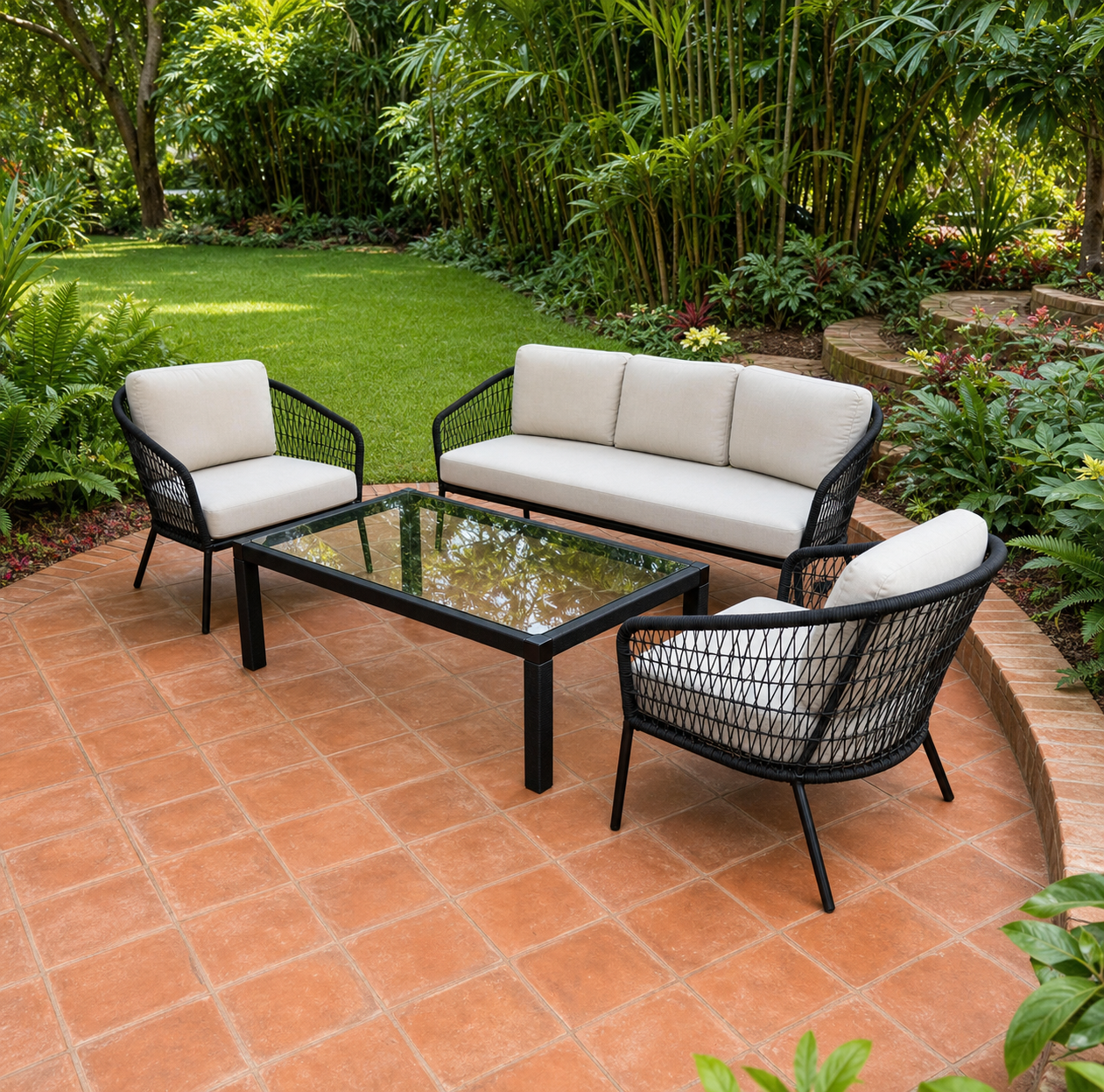 Sharp detailed woven outdoor lounge collection with cream cushions and a glass-topped table on a landscaped hotel terrace