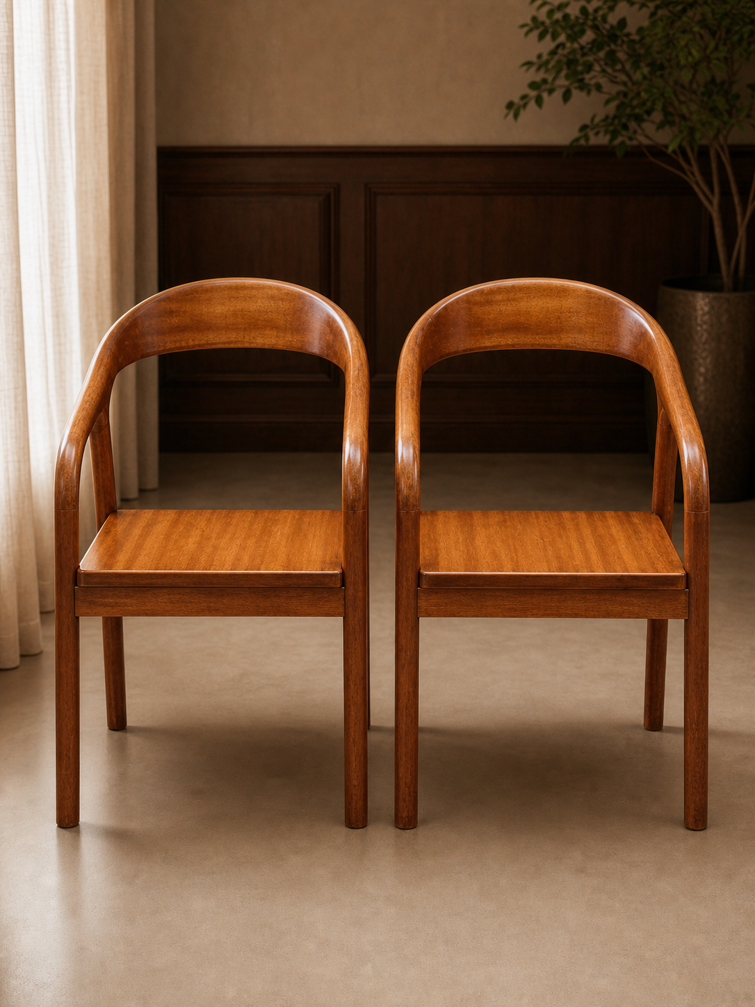Pair of upright sculpted solid wood dining chairs in a refined hospitality interior
